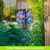 Briarwood Lane Colorful Hydrangeas Solar Balloon Lantern with blue, pink flowers and green leaves hanging outdoors.