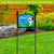 Acrylic art sign on stand reading "Please clean up after your dog" with cartoon dog.
