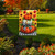 Harvest Pumpkin Stack Garden Flag with orange, white, and plaid pumpkins on a checkered background.
