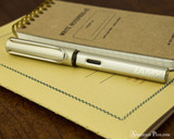 Lamy LX Fountain Pen - Palladium - On Notebook