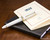Sailor 1911 Large Fountain Pen - White with Gold Trim - Closed on Notebook
