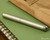 Kaweco Liliput Fountain Pen - Stainless Steel - Closed on Notebook