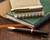 Pilot E95S Fountain Pen - Burgundy and Ivory - Open on Notebook