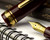Sailor 1911 Large Fountain Pen - Maroon with Gold Trim - Nib on Notebook
