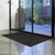 Apache Mills pepper waffle entrance mat on floor showing raised molded texture and SBR rubber border