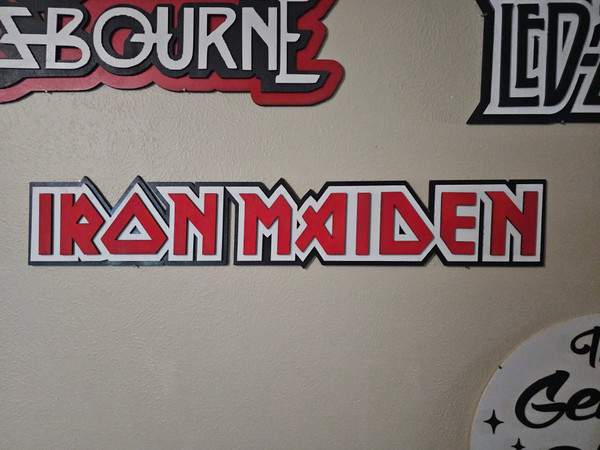 Custom-made Iron Maiden wooden sign featuring painted band logo and artwork on wood, designed for wall display or home decor.