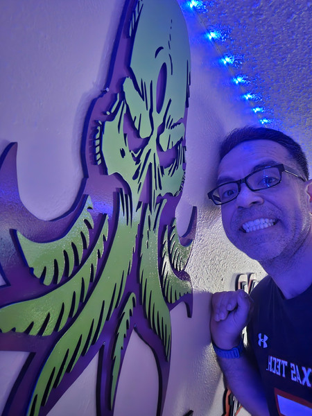 Handmade wooden Cthulhu wall art with glossy purple and green finish, inspired by H.P. Lovecraft – 25x18 inch indoor sign