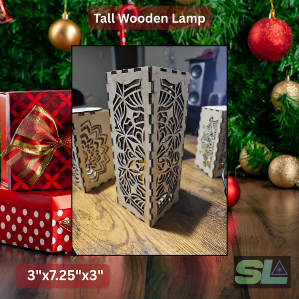 Wooden table lamps with detailed laser-cut mandala designs, arranged on a wooden surface and softly illuminated, creating warm decorative light patterns.