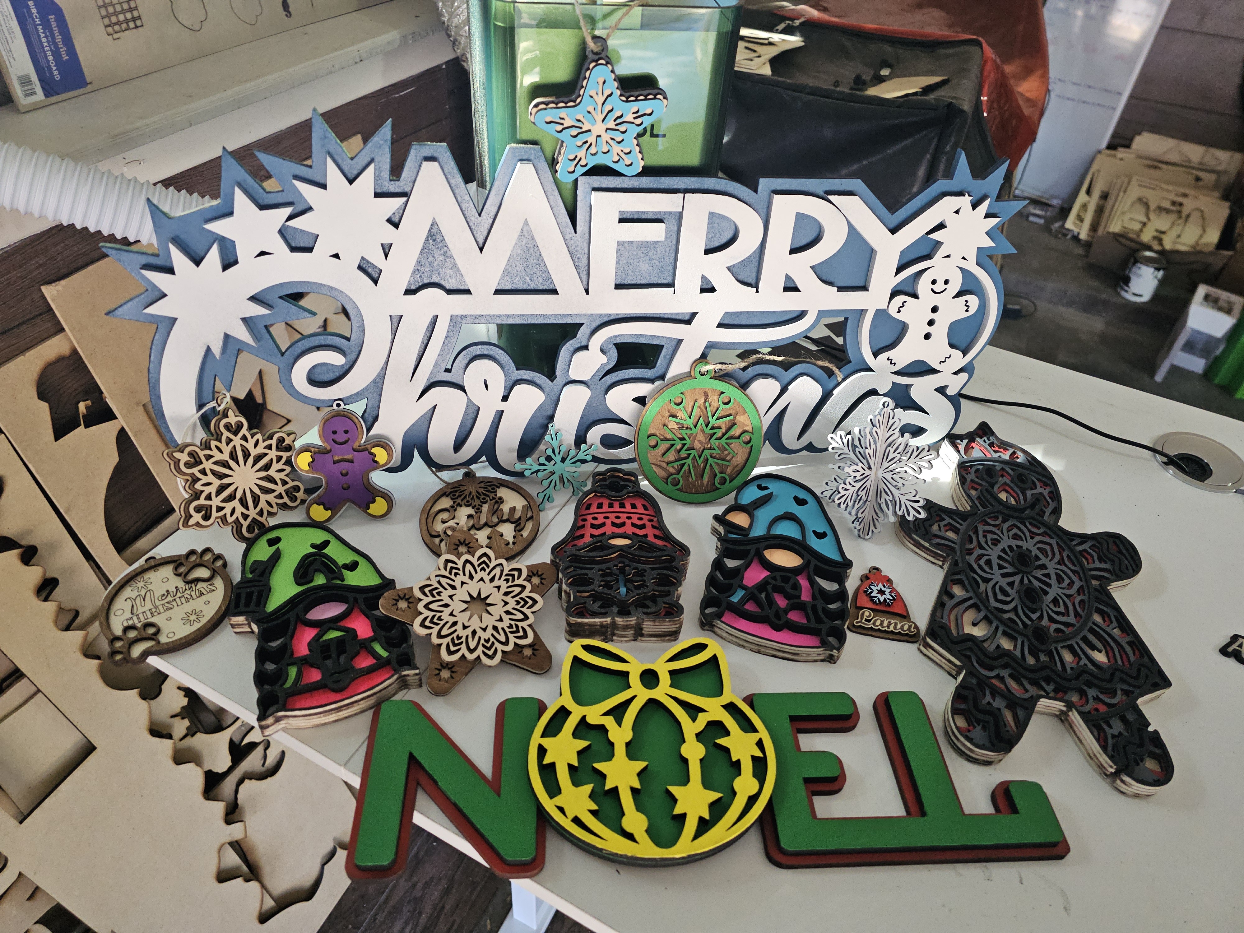 Ornaments and layered wooden signs and mantel decor