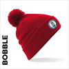Red bobble with embroidered Sir Fynwy 100 badge on cuff