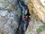 A solo, unroped rock climber slipped and landed on this precarious shelf 70 feet up a waterfall. In this picture, Steve and his teammates prepare to lower the now-paralyzed climber to waiting rescuers.