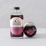 A bottle of Crescent Simples Grenadine syrup.