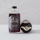 A bottle of Crescent Simples Blackberry Vanilla simple syrup.
