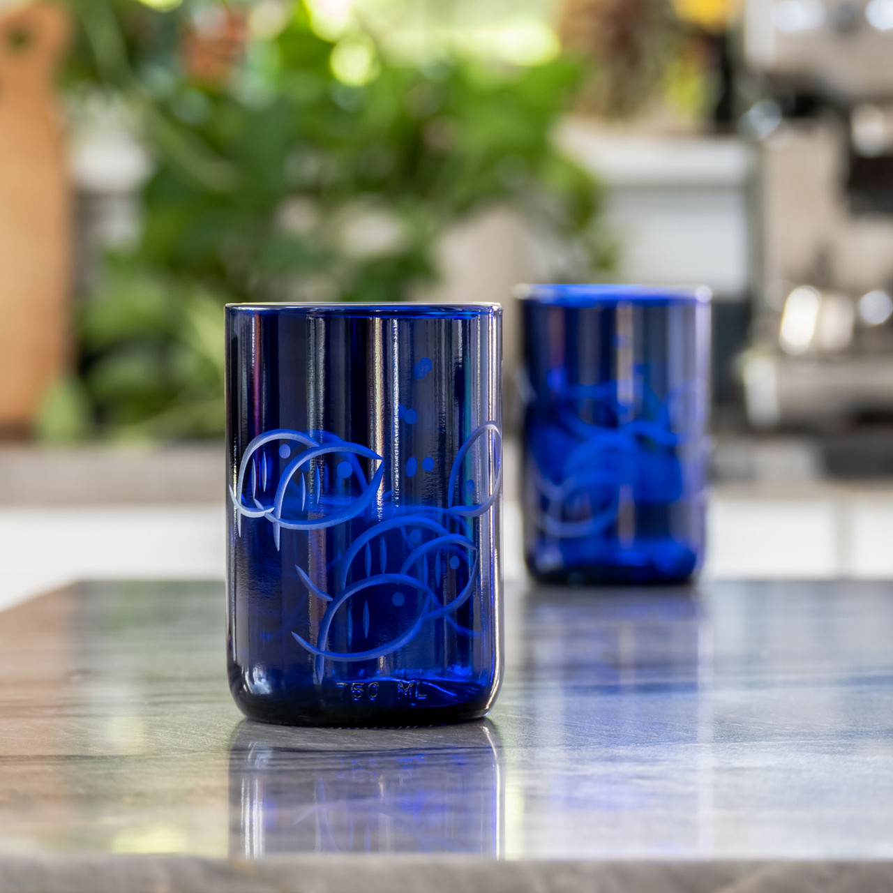 https://cdn11.bigcommerce.com/s-ofntu11k/images/stencil/1280x1280/products/33620/100533/306353_rolfglass_blue_fish_14oz_recycled_tumbler_lifestyle_02__48995.1694800462.jpg?c=2