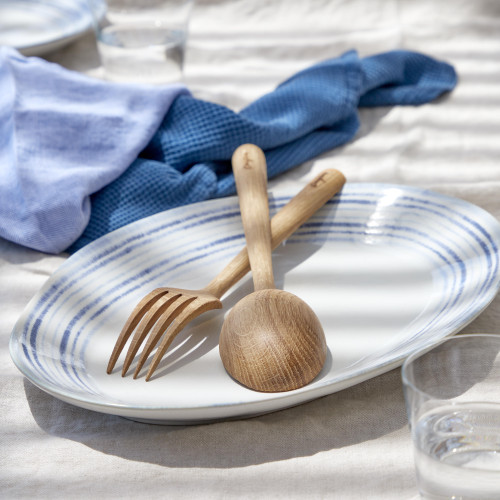 Nantucket White and Blue Striped Oval Platter on table with serving spoons