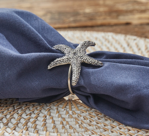 Sea Star Set of Four Napkin Rings with blue napkins