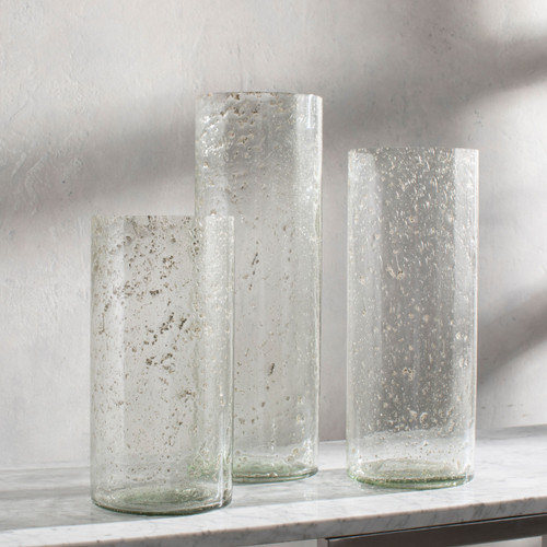 Translucent Set of Three Glass Cylinder Vases on shelf