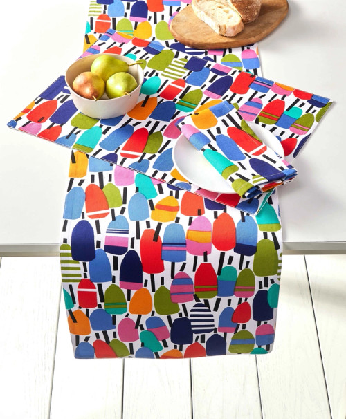 Bright Buoys 72 Inch Table Runner on table with matching pieces