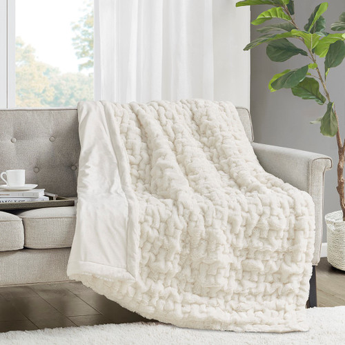 Ivory Ruched Faux Fur Throw on sofa