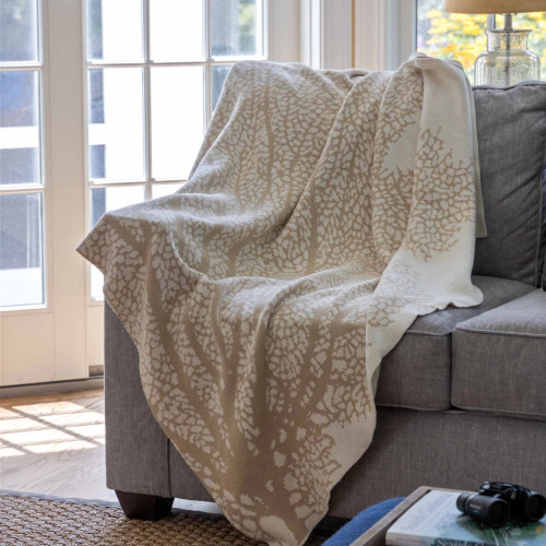 Sea Fan Coral Knit Throw in Sand on sofa