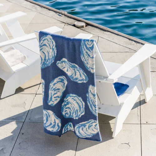 Blue Oyster Shell Eco-Knit Throw on chair Blue Oyster Shell Eco-Knit Throw on chair