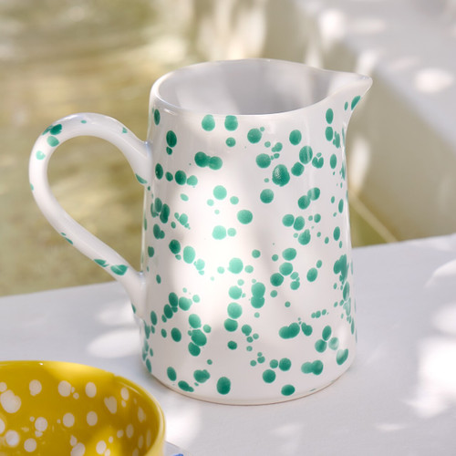 Green and White Polka Dot Pitcher on table 1