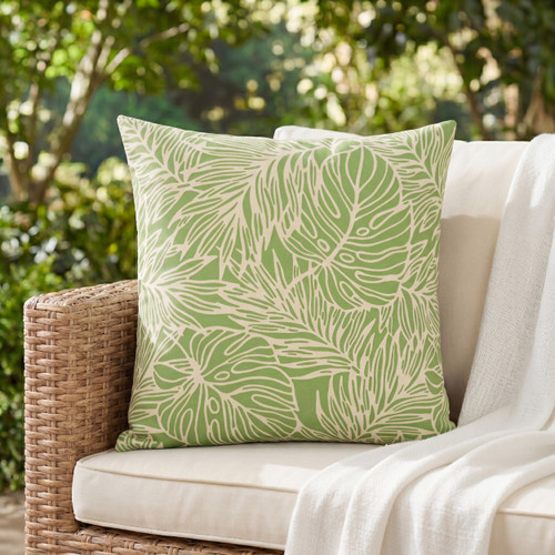 Lime Green Resort Palm Leaves 18 x 18 Outdoor Pillow on sofa