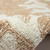 Coral Bordered Beige and Ivory Tufted Area Rug close up