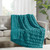Teal Ruched Faux Fur Throw on sofa