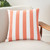 Beach Cabana Coral Striped Throw Pillow on chair