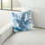 Blue Palm Leave Embroidered Throw Pillow pillow on sofa