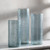 Mist Blue Set of Three Glass Cylinder Vases on shelf