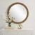 Surfside Beach Faux Rattan Round Mirror on wall example