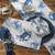 Atlantic Blue Crab Placemats - Set of Four on table with other pieces