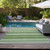 Gulf Shores Aloe Green Horizontal Stripes Rug by the pool