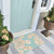 Seafoam Sand Dollar Scattered Shells Rug front door