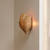 Anguilla Mango Wood Beaded Wall Sconce in Natural on the wall