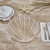 Scallop Shell Shaped White Woven Rattan Charger on table