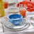 Cornflower Blue Polka Dot Rafaela Dinner Plate on table with Summer Bliss