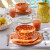Tangerine Polka Dot Rafaela Cereal Bowl on the table