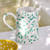 Green and White Polka Dot Pitcher on table 1