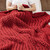 Red Chunky Handmade Double Knit Throw close up on bed
