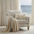 Eloise Linen Palm Embroidered Lumbar Pillow Cover on a chair