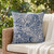 Navy Blue Resort Palm Leaves 18 x 18 Outdoor Pillow on sofa
