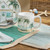 Deck the Palms Set of Four Coffee Mugs on table