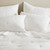 Sea Breeze White Cotton Embroidered Euro Sham on bed 1