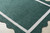 Cocoa Beach Dark Green and Cream Scalloped Rug on the floor