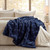 Villa Mar Navy Faux Fur Throw on bed