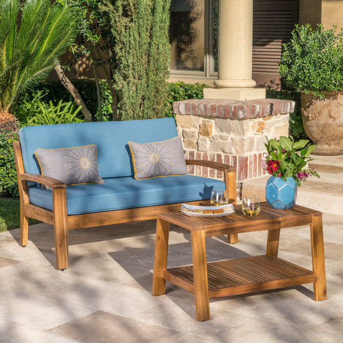 Christian Outdoor Teak Finished Acacia Wood Loveseat and Coffee Table Set with Blue Water Resistant Cushions