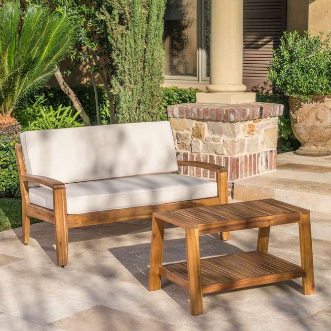 Christian Outdoor Teak Finished Acacia Wood Loveseat and Coffee Table Set with Beige Water Resistant Cushions